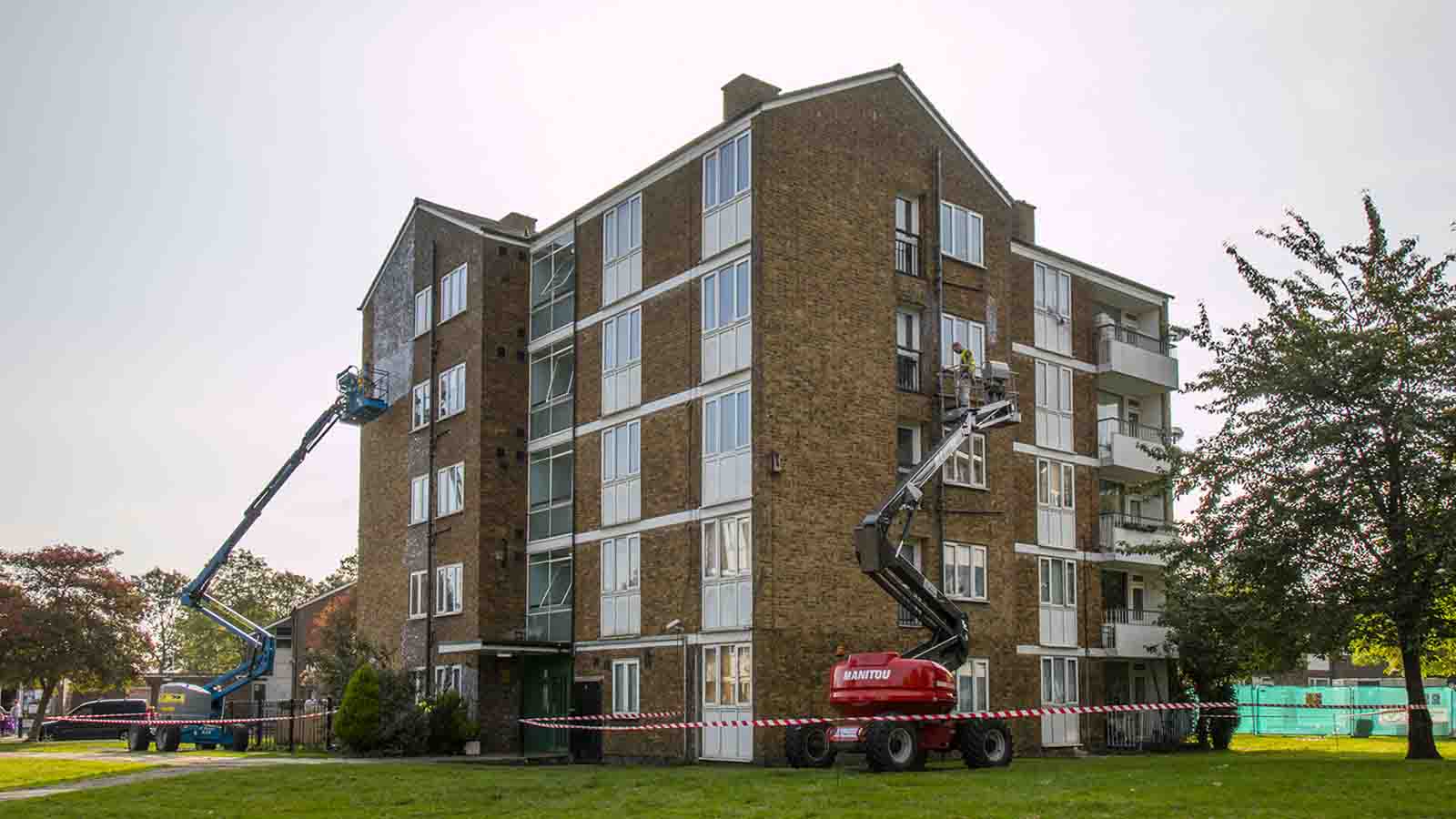 Applying Stormdry Masonry Protection Cream to the buildings using cherry pickers