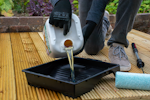 Decanting Decking Oil into a paint tray