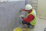 Dryzone Damp-Resistant Plaster being applied to a wall for flood resilience purposes
