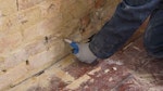 Installing Dryrod Damp-Proofing Rods into the base of the wall to form a damp-proof course