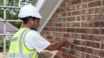 Repointing the brickwork with Stormdry Repointing Additive