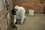 A YDC Basements Contractor applying Drybase Tanking Materials
