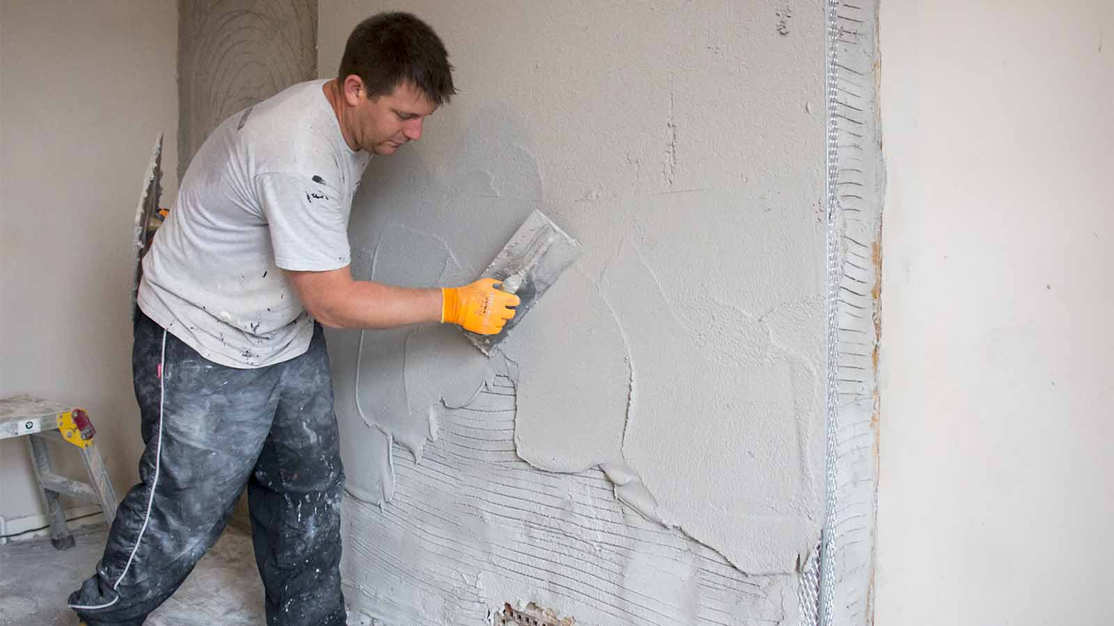 Damp-resistant plaster to combat penetrating damp in domestic property in  Horsham