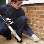 Injection of Dryzone Damp-Proofing Cream into a damp wall