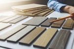 A designer looks over a selection of hardwood samples.