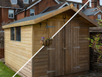 A wooden shed before/after Roxil Wood Scrub Gel application