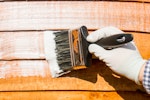 Roxil Wood Protection Cream being applied to a fence panel